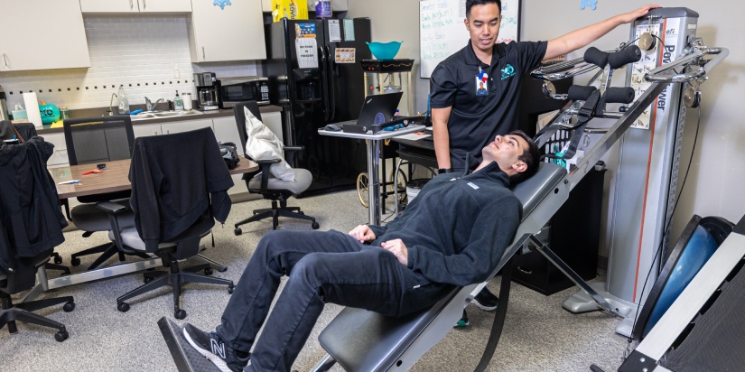 physical therapy for scoliosis. XO expert in physiotherapy during his work with a patient